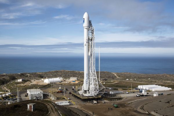 A SpaceX Falcon 9 rocket on the launch pad; one SpaceX share closed at $146.03 on Friday.