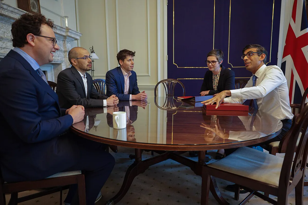 AI developers at a policy event as Anthropic IPO and Claude AI stock draw investor attention