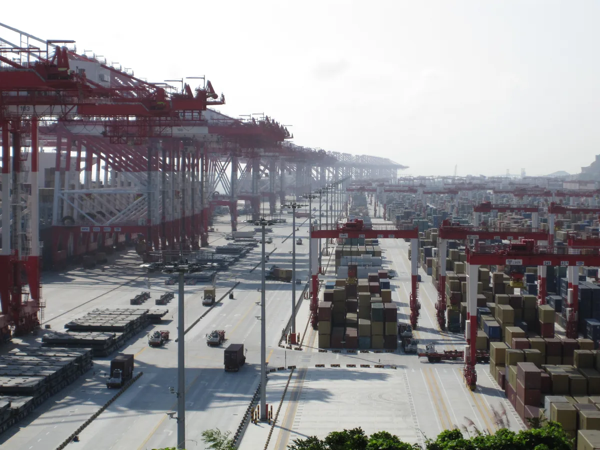 Container cranes at a Chinese shipping port handling export cargo