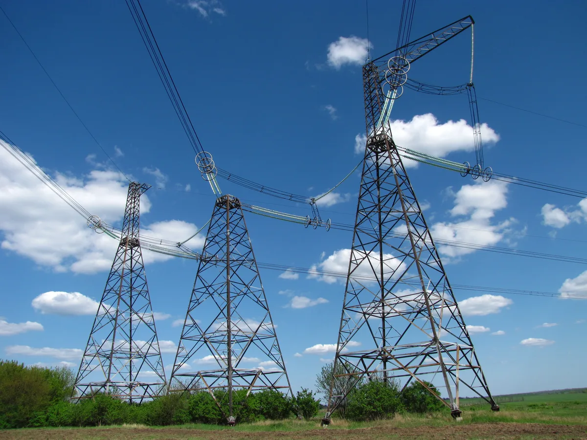 High-voltage power pylons — UK grid operators say power will not reach the planned Nscale Essex data center until the 2030s