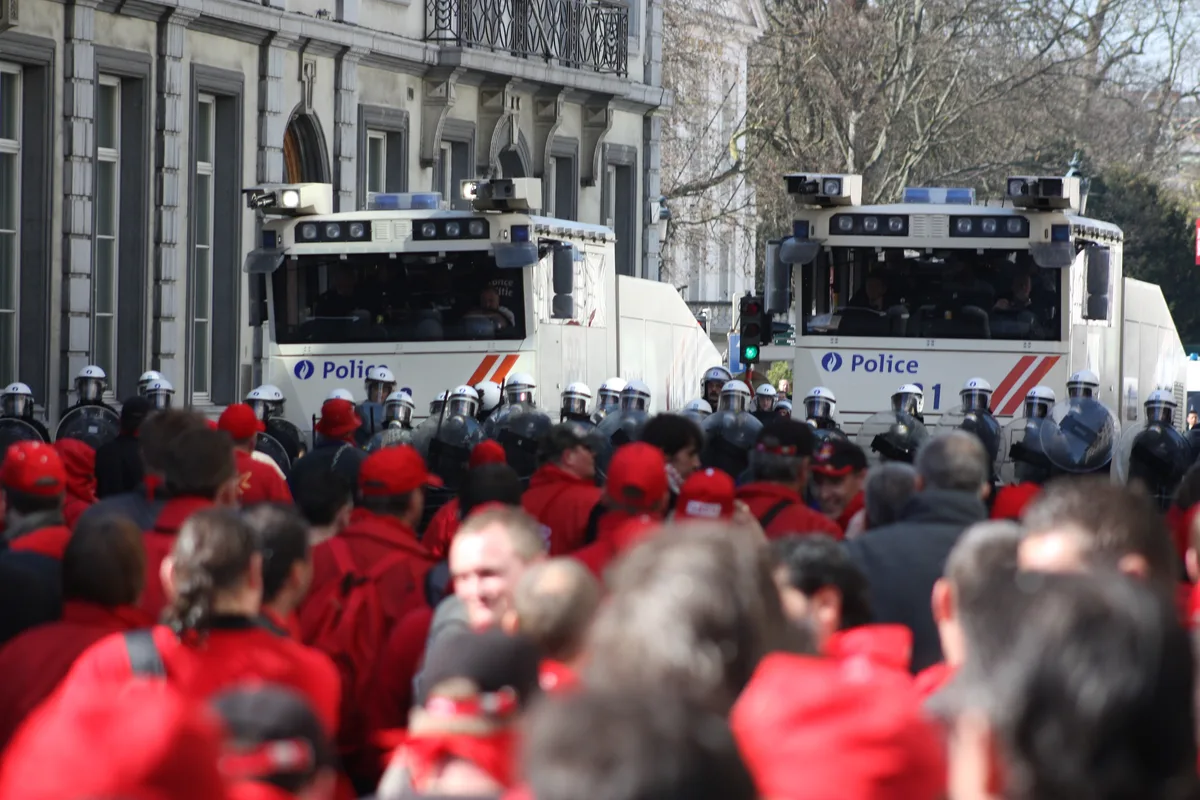 Police water cannon vehicles face protesters in Brussels